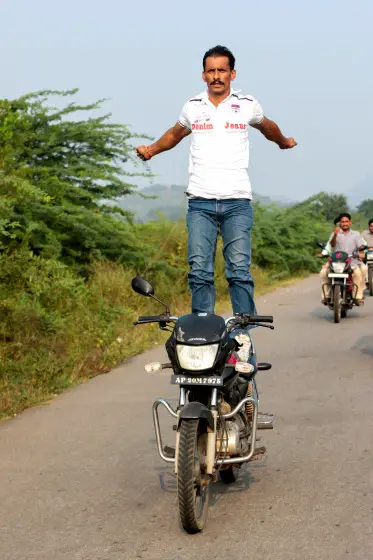 High Octane Yoga: Indian Man Pulls Yoga Poses On Speeding Motorbike