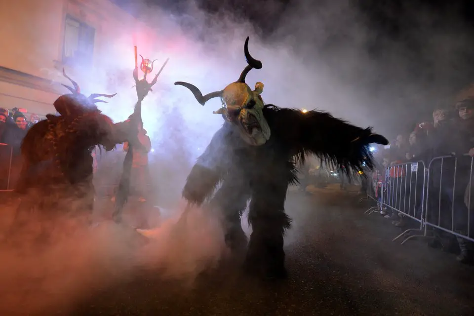 Actors dressed as "Krampus" figures present a show of a traditional custom in Kaplice, South Bohemia, on December 12, 2015. The "Krampus" figures, who belong to a centuries old custom common in the Christmas season, traditionally are known as creatures who punish children that misbehaved. AFP PHOTO / MICHAL CIZEK / AFP / MICHAL CIZEK (Photo credit should read MICHAL CIZEK/AFP/Getty Images)
