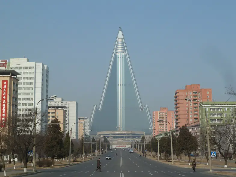 Ryugyong-hotel-towers-at-the-end-of-a-Pyongyang-street
